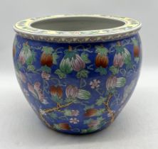 A 20th century Chinese fish bowl with floral butterfly pattern