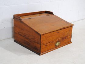 A pitch pine clerks desk, with lift up top and single drawer - length 60.5cm, depth 54cm, height