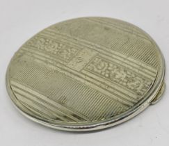 A hallmarked silver compact by Kigu
