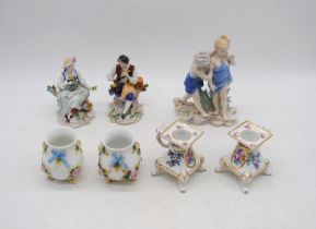 A small quantity of continental floral encrusted porcelain figures and vases etc.