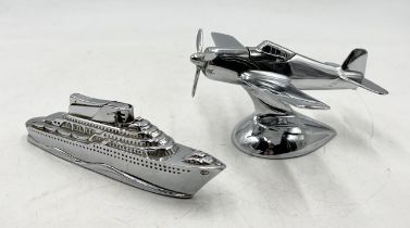 An Art Deco chrome plated table lighter in the form of a Mustang plane along with another in the