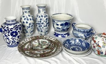 A large collection of oriental china including Famille Rose charger, blue and white vases, ginger