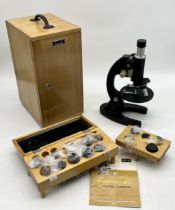 A XSC-04 Biomicroscope in wooden case and booklets (case A/F) along with a collection of cased