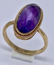 A 9ct gold ring set with an amethyst