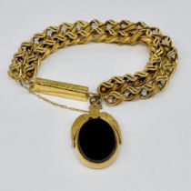 A Victorian unmarked 9ct gold fancy bracelet with a 9ct gold swivel fob attached, clasp tests as