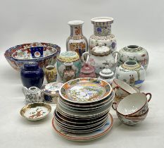 An assortment of oriental vases, bowls, plates etc
