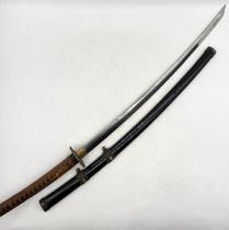 A Japanese Katana, the Tang signed with four character mark above a Damascus style blade. Fitted