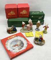 A collection of Rupert Bear figures including Royal Doulton Beswick Ware Happy Birthday Rupert,