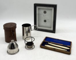 A silver plated military campaign stove in leather case along with two framed antique military