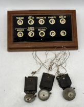 A 19th century servants bell call board with three later GEC bells attached