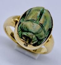 An 18ct gold ring set with a scarab and hieroglyphics to reverse, weight 6.1g, size N 1/2