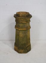 A weathered terracotta chimney pot - diameter 32cm, height 82cm