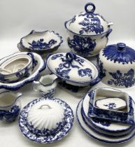 A collection of mainly Staffordshire Ironstone blue and white china with floral decoration including