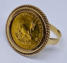 A 1/10 oz Krugerrand set in 9ct gold ring mount, total weight 5.9g