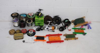 A small quantity of various fishing tackle and reels, including a boxed Intrepid Deluxe model