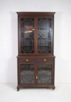 A Victorian mahogany astragal glazed secretaire bookcase, with two drawers and blind fretwork