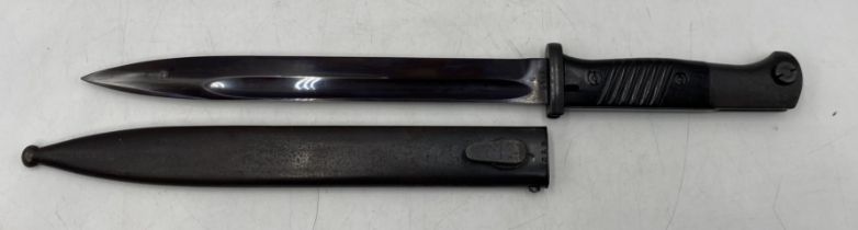 A German WWII bayonet by Clemen & Jung, the blade numbered 3846b, the metal scabbard marked 41asw