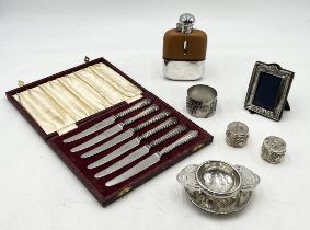 A collection of items including small silver photo frame, silver handled knives and a number of