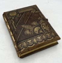 A Victorian leather bound musical photo album, complete with key.