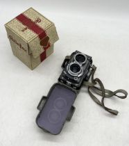 A Rolleiflex Baby Grey Camera by Franke and Heidecke in original carry case and box