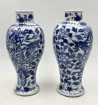 A near pair of 19th century Chinese blue and white vases with dragon pattern and four character mark