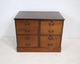 A mahogany chest of four filing drawers (with keys), with brown leather inset top - length 95.5cm,