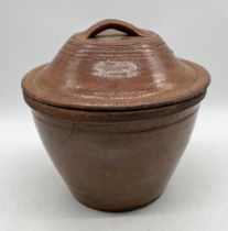 A glazed terracotta lidded dairy bowl