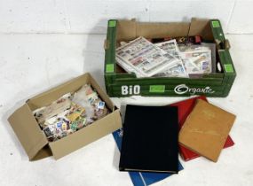 A large collection of stamps both loose and in a number of albums