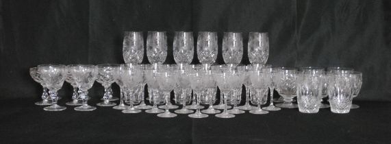 A quantity of various cut glass drinking glasses, including some Stuart crystal glass and