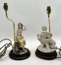 A Capodimonte lamp signed B. Merli 1983 in the form of a dog and two children along with a similar