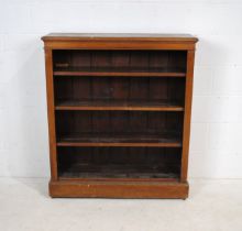 An oak freestanding four tier bookcase - length 101cm, depth 29.5cm, height 117cm