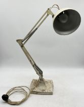 An early Herbert Terry Anglepoise lamp on cast metal base and four springs