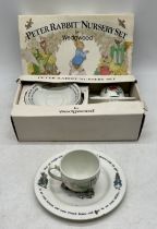 A vintage boxed Peter Rabbit nursery set by Wedgwood, lot also includes an additional cup (repaired)