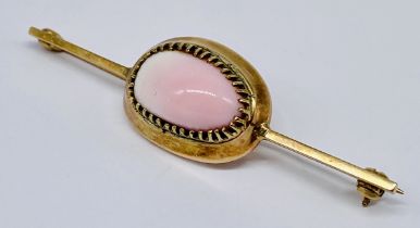 An antique 9ct gold brooch set with coral, weight including stone 11.4g