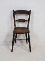 An antique elm Oxford chair, with turned supports