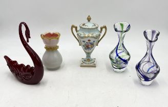 A collection of glass including two vases by Bartelts, along with a gilt lidded urn by Atelier le