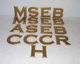 A quantity of shop display gold plastic letters