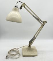 An early Herbert Terry Anglepoise lamp on cast metal base and four springs