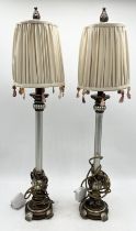 A pair of modern table lamps with beaded detail to shade