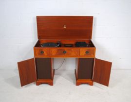 A Garrard/Dynatron hi-fi music centre in the form of a desk, with a Garrard SP25 MkV belt-drive