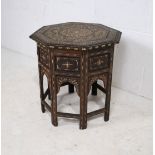An Eastern folding hardwood octagonal table with ornate decoration - diameter 55cm, height 53cm