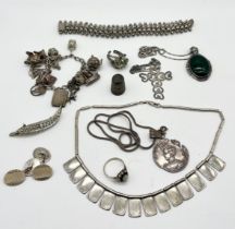 A collection of silver and SCM jewellery including charm bracelet, rings, silver cross on chain etc.