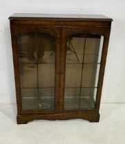 A walnut veneered display cabinet - length 89cm, depth 30cm, height 111cm