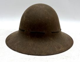 A second world war civil defence Zuckerman helmet, stamped with a M and J.S. 1941