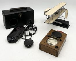 A vintage Ardent boxed hearing aid along with a Franklin Mint "Wright Flyer" 100th anniversary model