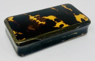 An antique tortoiseshell and horn snuff box