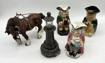 A collection of three Toby jugs, Beswick shire and serpentine lighthouse lamp