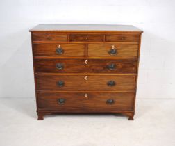 A Scottish mahogany chest of eight drawers, with ivory escutcheons above brass handles, raised on