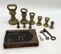 A collection of graduated brass bell-shaped weights, the largest 7lbs and stamped Avery Ltd, along