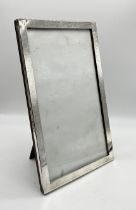 A hallmarked silver rectangular photo frame - 14.5cm x 23cm